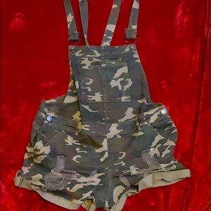 Ripped camouflage overalls.
